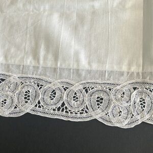 2 white, king size pillow cases from Hong Kong with handmade lace.